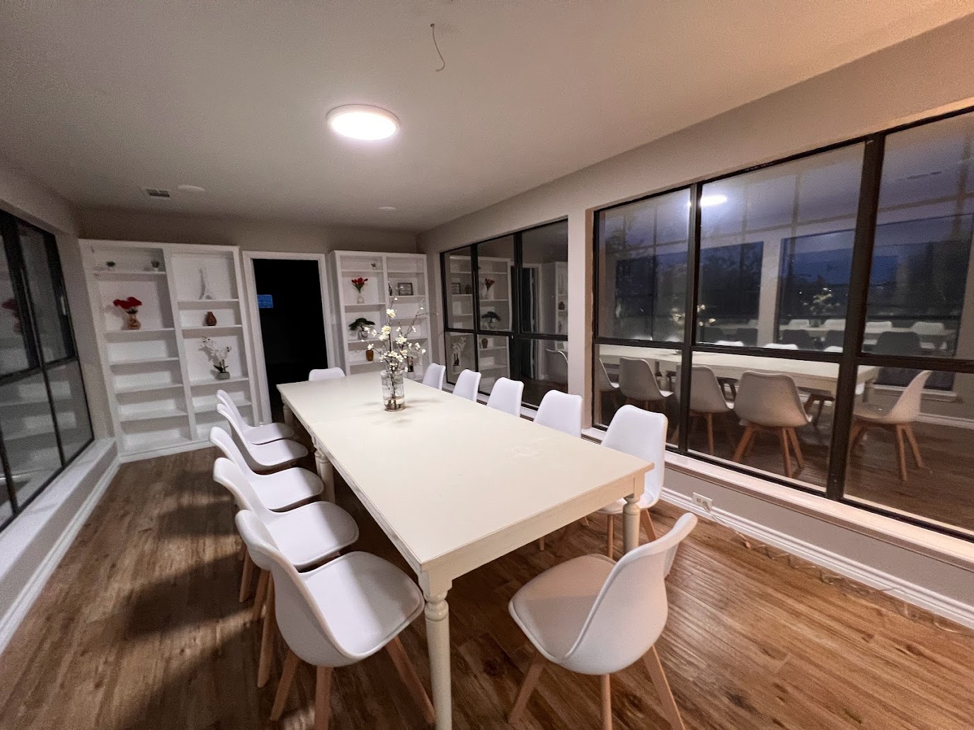 Glass-walled dining room at the 5-acre Nor Haus estate for graduations and family dinners